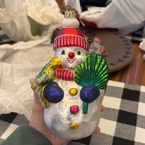 Festive Snowman Ornament with Parrot and Green Leaf